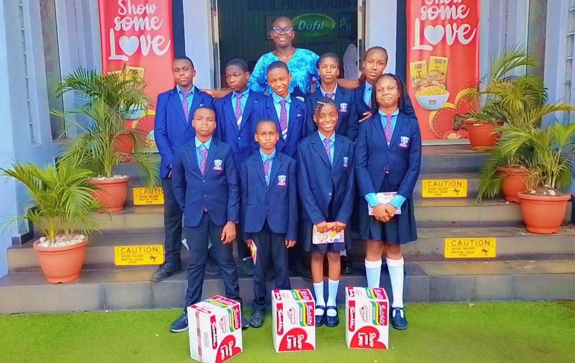 BOBAES pupils in graduation gowns with gift bags