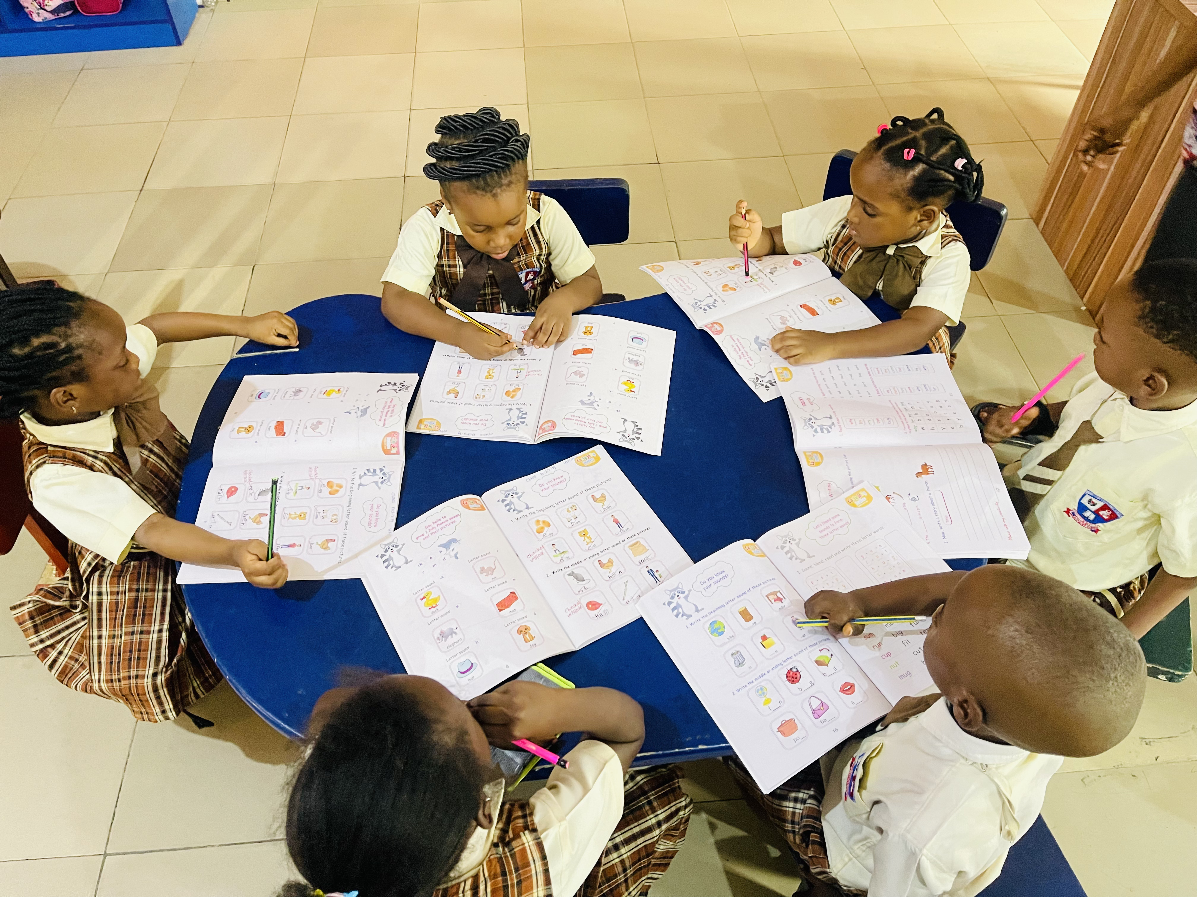 Early-years pupils working together in a classroom activity