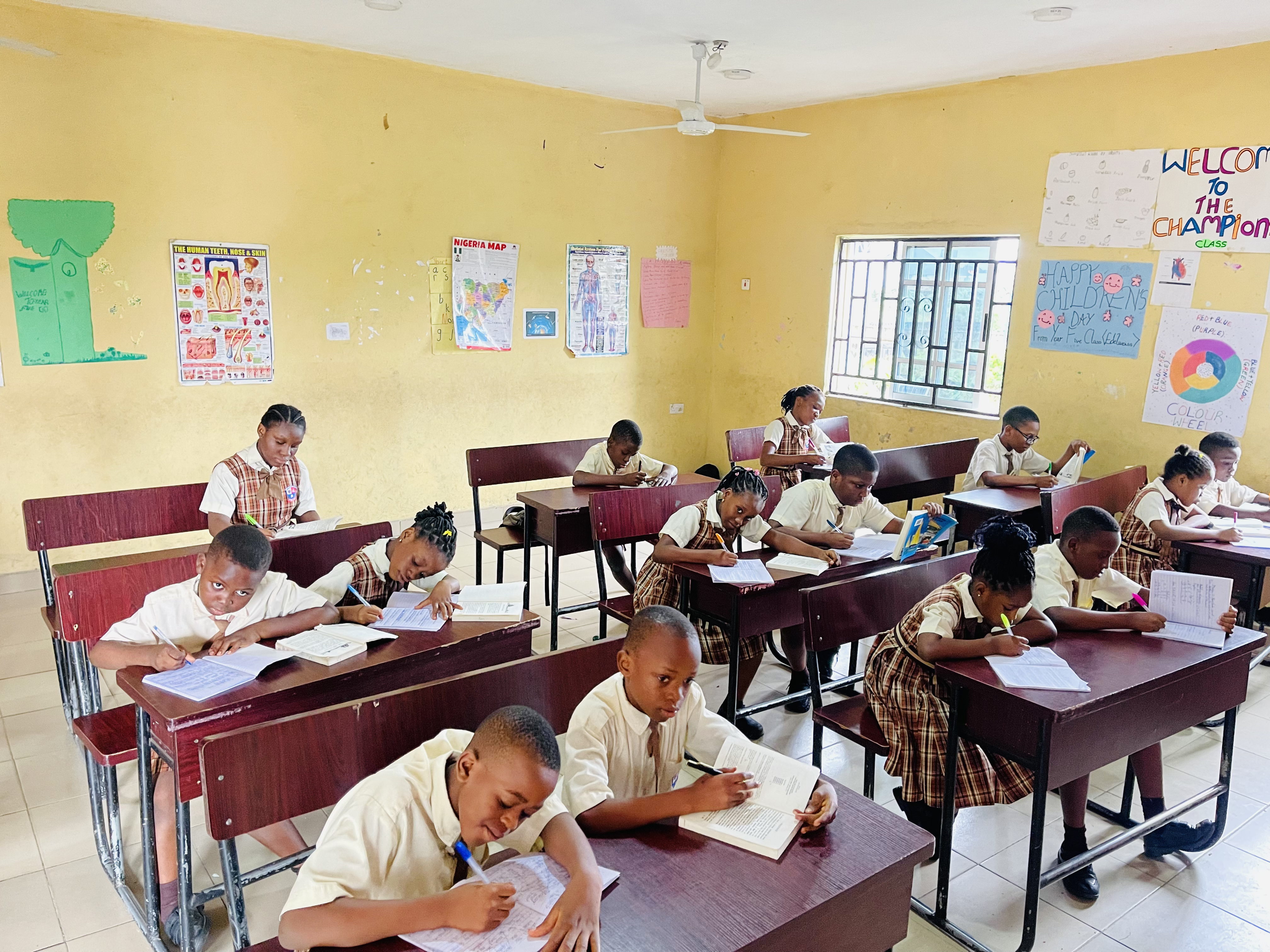 BOBAES pupils writing and studying in a classroom