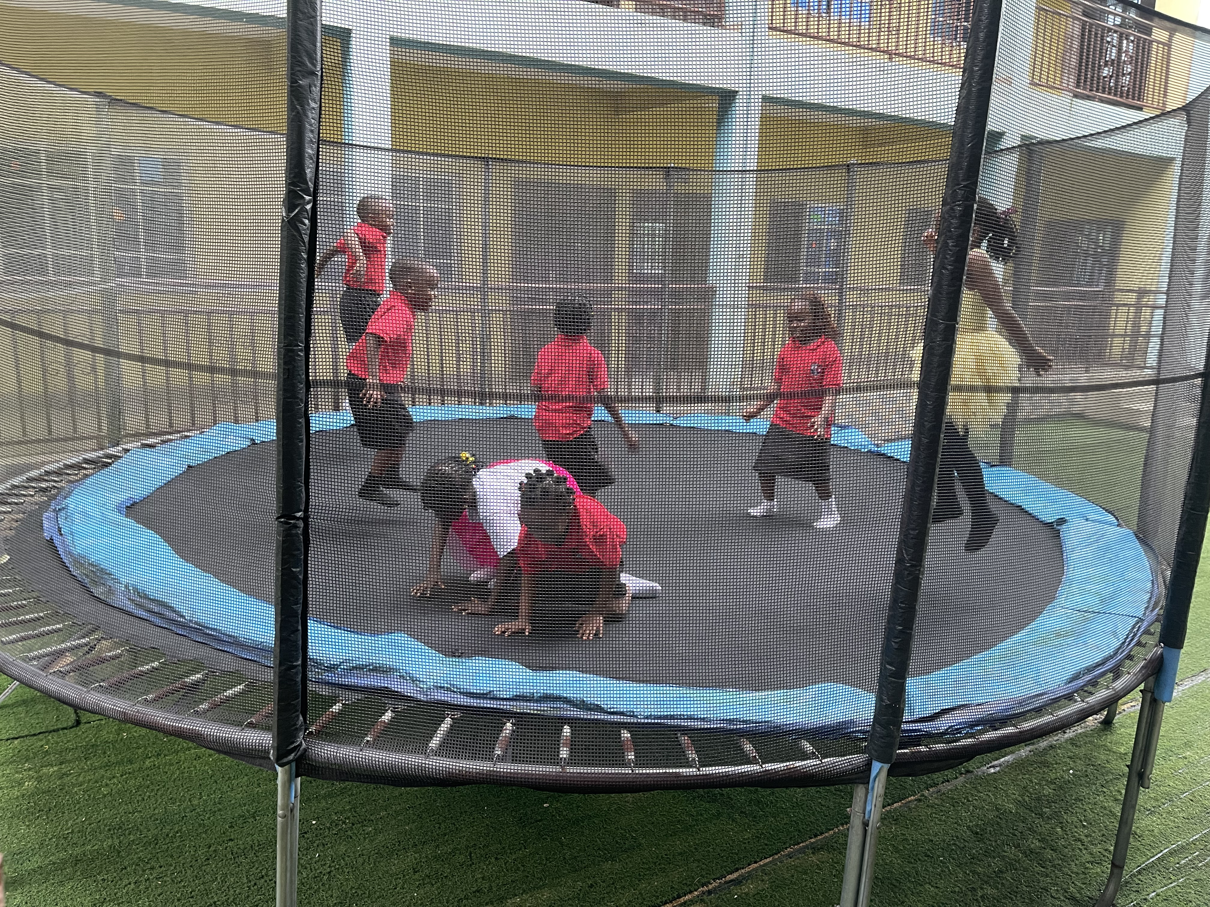 BOBAES pupils using playground equipment during supervised play